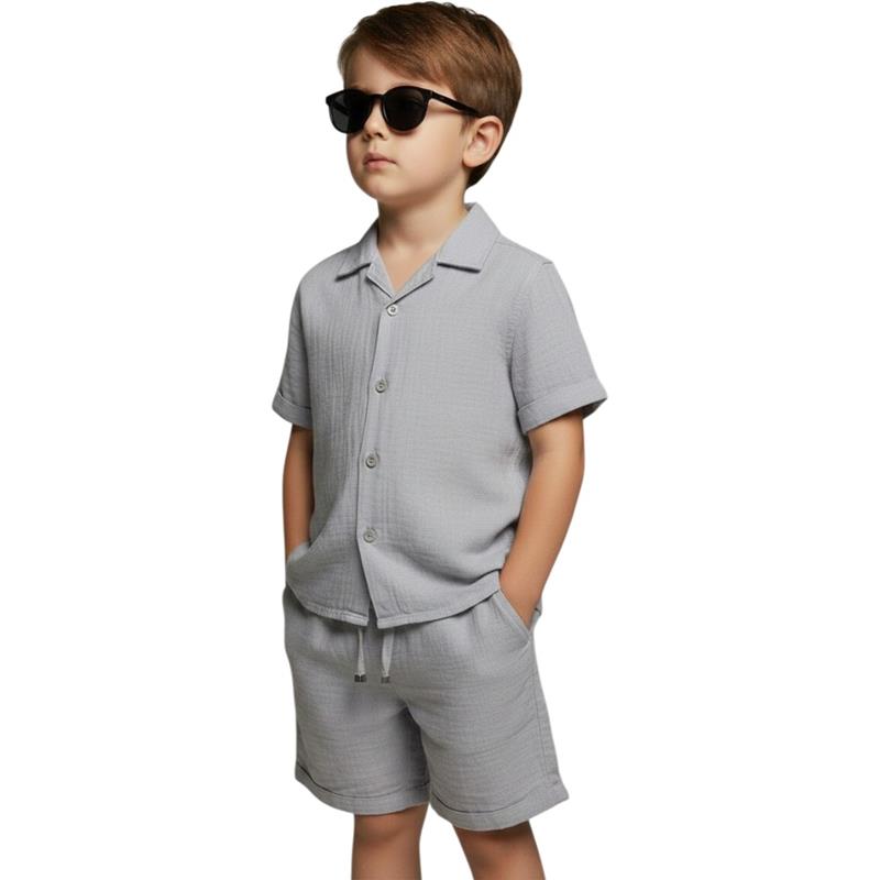 Wholesale two-piece summer suits for boys aged 11-15, consisting of a muslin shirt and shorts.